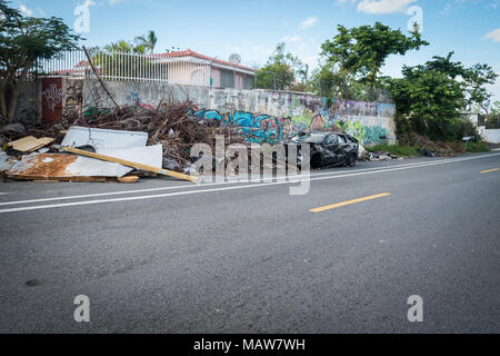 Caimito, Puerto Rico. 30th November, 2017. Refuse and garbage lays in piles on the side of the roads throughout Puerto Rico months after Hurricane Maria devastated the island. Residents are starting to complain of rat infestations due to nesting areas provided by these piles, as well as lack of lighted areas at night. Credit: Sara Armas/Alamy Reportage. Stock Photo