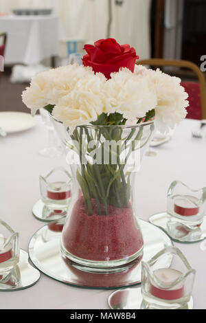 Wedding flowers in vase on table Stock Photo