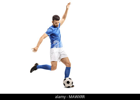 Soccer player kicking a football isolated on white background Stock Photo