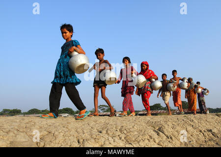 Khulna, Bangladesh - October 08, 2014: Bangladeshi women carry drinking ...