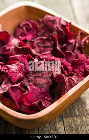 Dried beetroot chips in bowl. Stock Photo