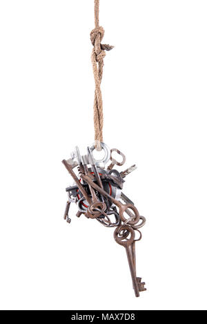 Two-way steel round search magnet with a many old keys, isolated on white background. Search in ponds and rivers, hunting for treasures. Stock Photo
