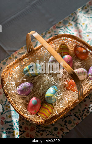 Colorful decorated easter eggs in a basket Stock Photo