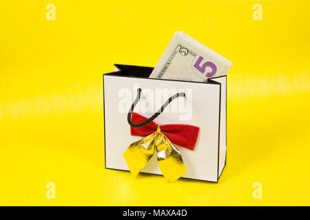 Download Paper Money In A Beautiful Gift Box With A Bow On A Bright Yellow Background Stock Photo Alamy PSD Mockup Templates