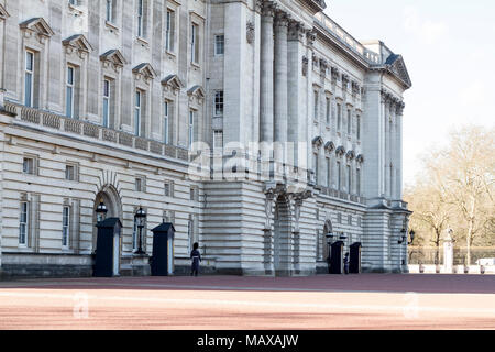 Royal Guard in Winter Uniform marching in the grounds of Buckingham Palace at the front on a sunny spring day, London UK, buckingham palace guards, Stock Photo