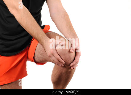 Man holds on to knee, pain in knee Stock Photo
