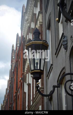 A wall lamp on a street in a dutch town. Stock Photo