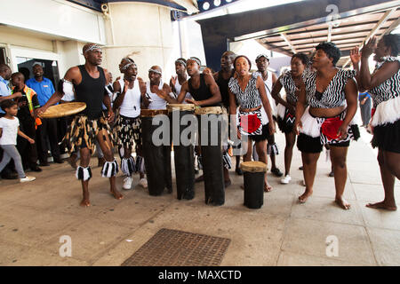 Dancers welcoming arriving travellers at Robert Gabriel Mugabe International Airport in Harare, Zimbabwe. The group performs traditional tribal dances Stock Photo