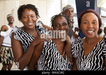 Dancers welcoming arriving travellers at Robert Gabriel Mugabe International Airport in Harare, Zimbabwe. The group performs traditional tribal dances Stock Photo