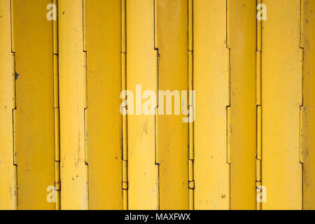 Yellow rusty shutter door background Stock Photo