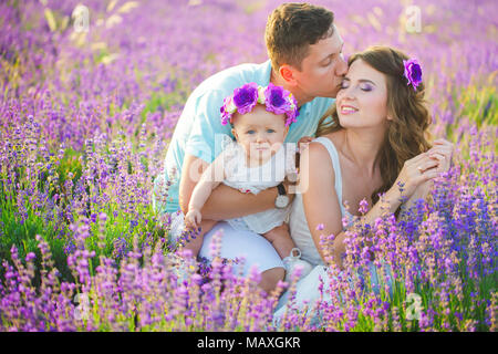 Young family in a lavender field Stock Photo