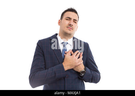 Businessman pressing chest expressing pain as hearth attack or failure concept isolated on white background Stock Photo