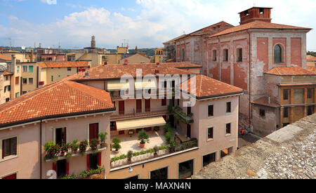 Verona, Veneto / Italy - 2012/07/06: Verona historic city center - Via Anfiteatro street area with surrounding historic tenements Stock Photo