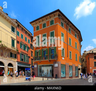 Verona, Veneto / Italy - 2012/07/06: Verona historic city center - Via Leoncino street area with surrounding historic tenements Stock Photo