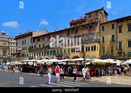 Verona, Veneto / Italy - 2012/07/06: Verona historic city center - Piazza Erbe Square area with surrounding historic tenements Stock Photo