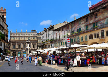 Verona, Veneto / Italy - 2012/07/06: Verona historic city center - Piazza Erbe Square area with surrounding historic tenements Stock Photo