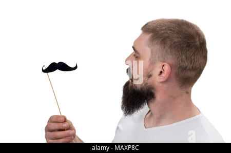 portrait of confident beautiful cunning men with false black mustache isolated on white background. With copy space. Stock Photo