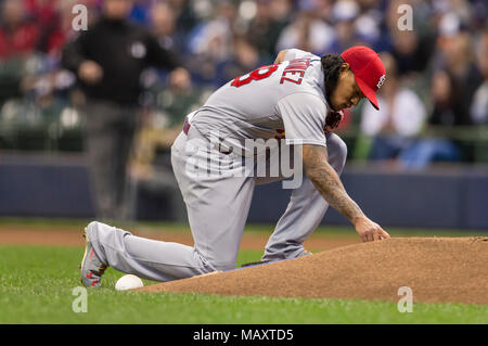 St. Louis Cardinals starting pitcher Carlos Martinez bends backwards to  watch a fly ball off the bat of Arizona Diamondbacks Chase Anderson just go  past the glove of right fielder Jason Heyward