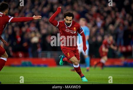 Liverpool. 4th Apr, 2018. Mohamed Salah of Liverpool celebrates scoring during the UEFA Champions League quarterfinal 1st Leg match between Liverpool and Manchester City at Anfield Stadium in Liverpool, Britain on April 4, 2018. Liverpool won 3-0. Credit: Xinhua) FOR EDITORIAL USE ONLY. NOT FOR SALE FOR MARKETING OR ADVERTISING CAMPAIGNS. NO USE WITH UNAUTHORIZED AUDIO, VIDEO, DATA, FIXTURE LISTS, CLUB/LEAGUE LOGOS OR 'LIVE' SERVICES. ONLINE IN-MATCH USE LIMITED TO 45 IMAGES, NO VIDEO EMULATION. NO USE IN BETTING, GAMES OR SINGLE CLUB/LEAGUE/PLAYER PUBLICATIONS./Xinhua/Alamy Live News Stock Photo