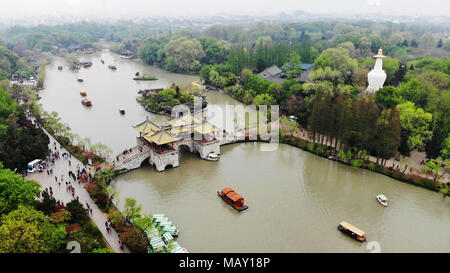 Tourists visit the Slender West Lake scenic area in Yangzhou, east ...