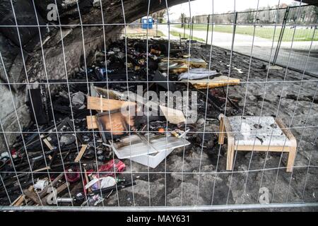 April 5, 2018 - A homeless camp under the ReichenbachbrÃ¼cke (Reichenbach Bridge) in Munich was the target of a suspected arson attack. The photos display the aftermath and the blackening of the surfaces of the bridge, as well as intense heat melting mattresses down to their springs. Damage to the bridge is estimated at 25,000 Euros. Four men, ages 24-53 were living there and unharmed. The suspects may have been two men who were standing near the fire and throwing objects into it. Credit: Sachelle Babbar/ZUMA Wire/Alamy Live News Stock Photo