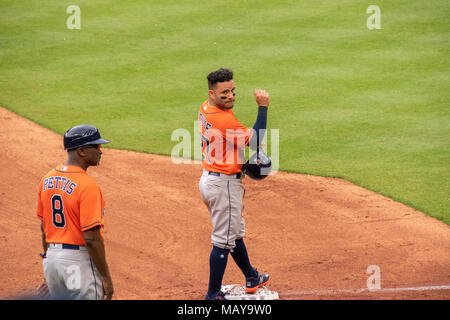 Houston Astros second baseman Jose Altuve stands at third base in game four of the season opener against the Texas Rangers. Astros won the series 3-1. Stock Photo