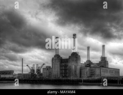 Black and white Battersea power station against a dark stormy sky before local develoments changing the iconic skyline Stock Photo