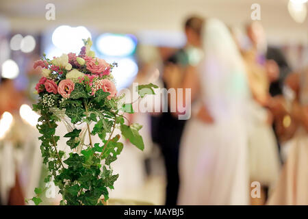 Newlywed couple dancing at wedding reception Stock Photo