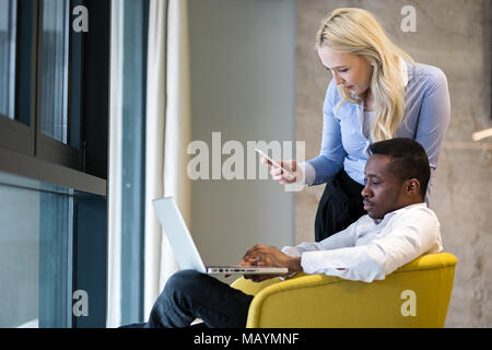 Colleagues working together. Multiracial teamwork concept Stock Photo
