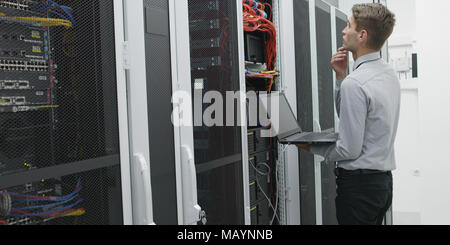 IT expert checking supercomputer server Stock Photo