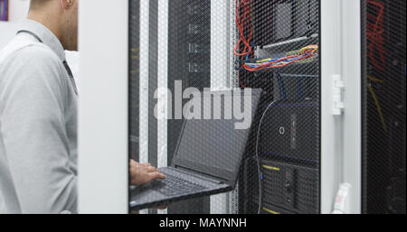 IT expert checking supercomputer server Stock Photo