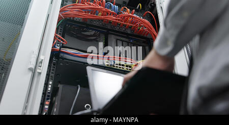IT expert checking supercomputer server Stock Photo