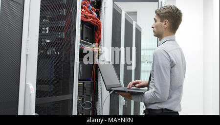 IT expert checking supercomputer server Stock Photo