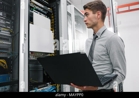 IT expert checking supercomputer server Stock Photo