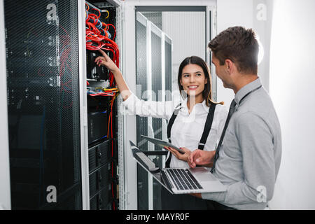IT expert checking supercomputer server Stock Photo