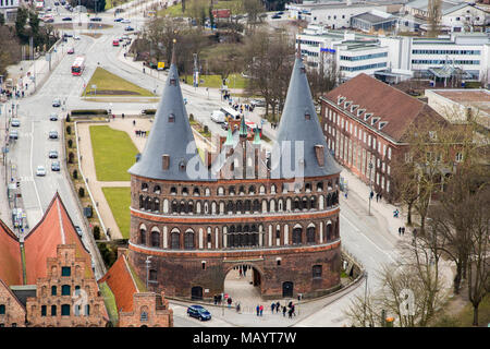 Lubeck, Germany. Aerial view of the Holstentor or Holstein Gate, one of the city gates of the Hanseatic City of Lubeck, from the tower of Petrikirche  Stock Photo
