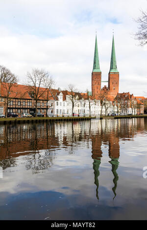 Lubeck, Germany. Views of Lubeck Cathedral (Dom zu Lubeck, Lubecker Dom) reflected in the river Trave. A World Heritage Site since 1987 Stock Photo
