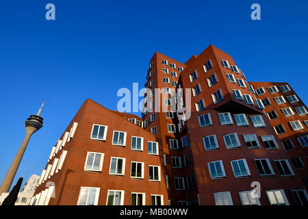 Rhine Tower with Gehry buildings, Neuer Zollhof, Media Harbour, Düsseldorf, North Rhine-Westphalia, Germany Stock Photo