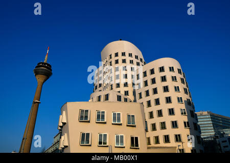 Rhine Tower with Gehry buildings, New Zollhof, Media Harbour, Düsseldorf, North Rhine-Westphalia, Germany Stock Photo