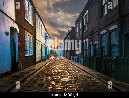Narrow cobbled streets in the old part of the Whitby town. Stock Photo