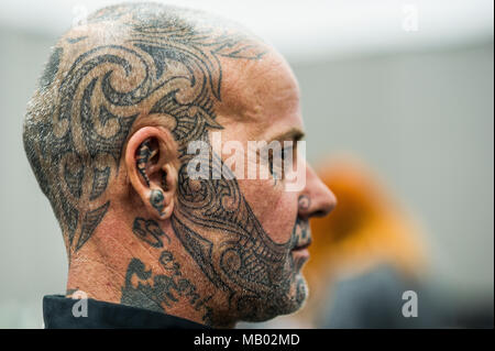 A man with a tattooed face and head at the Cornwall Tattoo Convention. Stock Photo