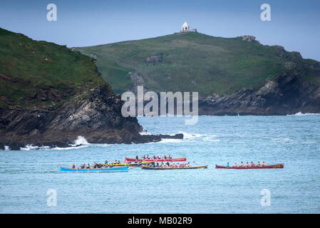 Traditional Cornish Pilot Gigs racing off the coast of Newquay in Cornwall. Stock Photo