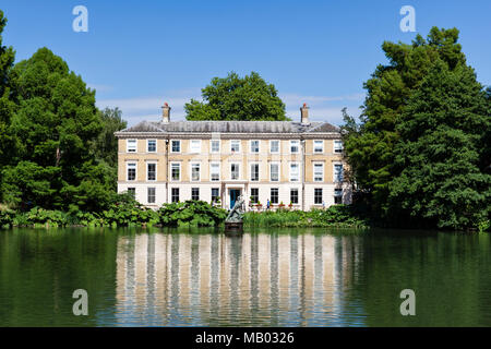 A view over Palm House Pond to Museum No 1 at Kew Gardens. Stock Photo