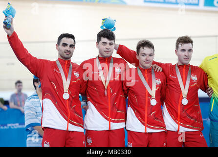 Left to right, England's Kian Emadi, Charlie Tanfield, Ethan Hayter and Oliver Wood on the podium with their silver medals after the Men's 4000m Team Pursuit Finals Gold Medal Race at the Anna Meares Velodrome during day one of the 2018 Commonwealth Games in the Gold Coast, Australia. Stock Photo