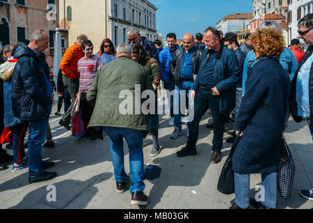 Con artists performing Shell Game scam to suspecting victims using matchsticks and small paper ball. The aim of the game is to predict in which box the ball will end up Stock Photo