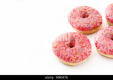 Pink frosted donut with colorful sprinkles. Isolated on white background. Stock Photo