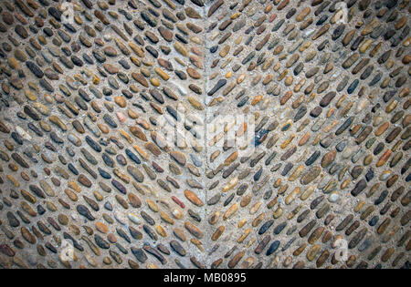 Stones in ground, old street road cobbles texture Stock Photo