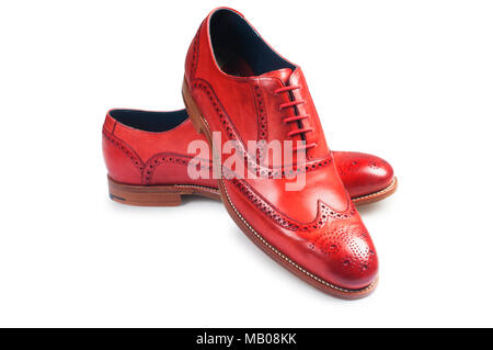 Studio shot of a mans red leather brogue isolated on white - John Gollop Stock Photo