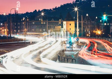 Big crossroad at the dusk. Light trails of the car in traffic jam. Prague, Czech Republic. Stock Photo