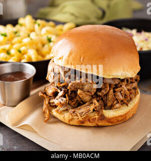 Pulled pork sandwich with bbq sauce on the table Stock Photo